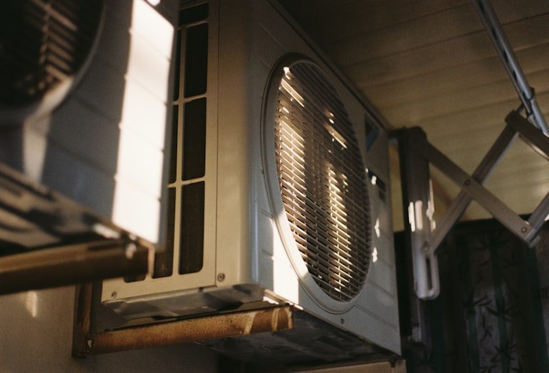 Air conditioning unit being serviced by a technician